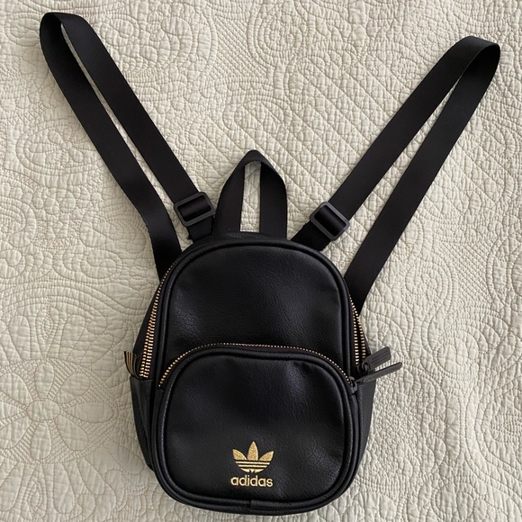 Adidas mini pu backpack in black.